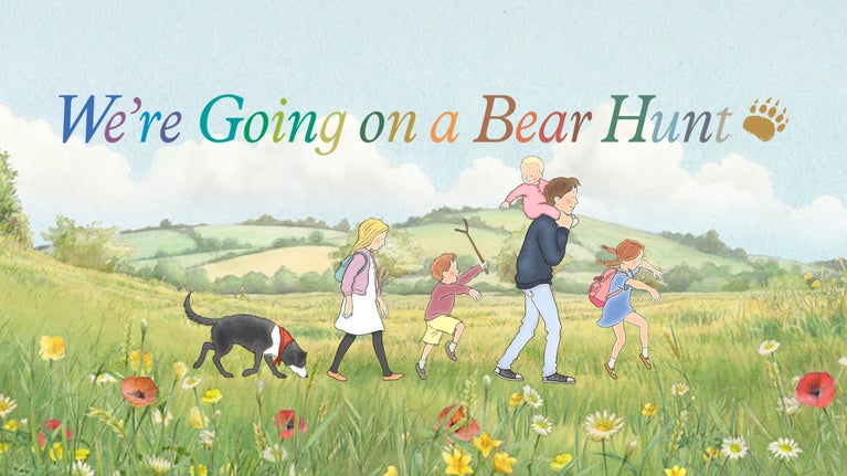 An illustration from the popular We’re Going on a Bear Hunt book showing a family walking and skipping through a field of grass and wildflowers